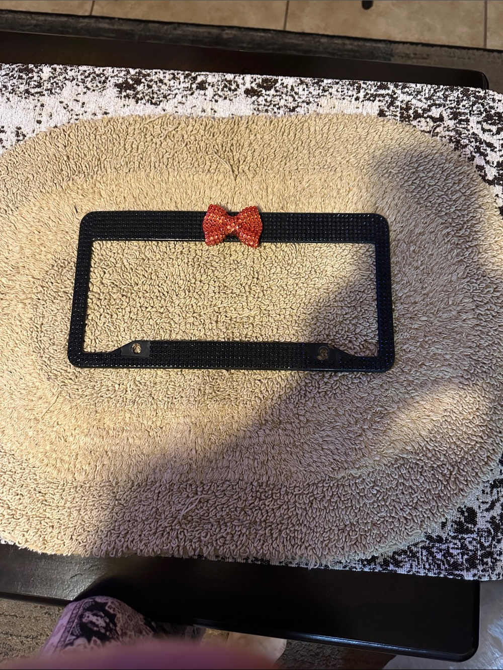 Black Rhinestone License Plate Frame with Orange Bow Accent
